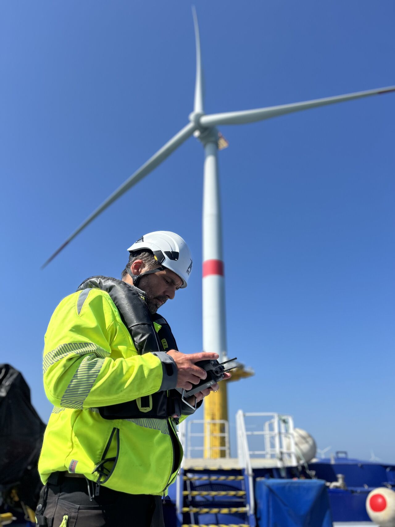 Clobotics field specialist working at an offshore wind site