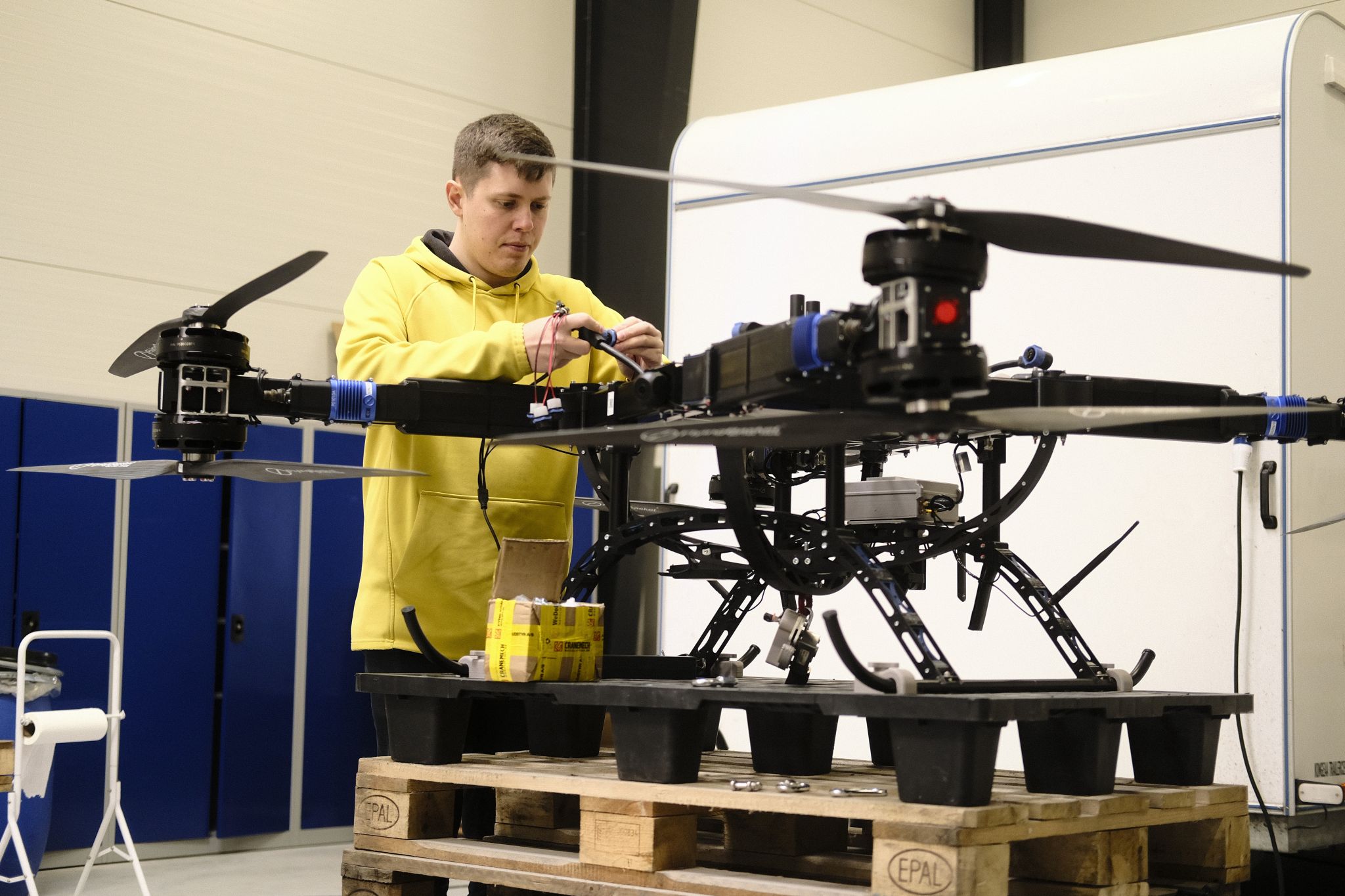 Clobotics engineer assembling the SPARROW drone and repair system